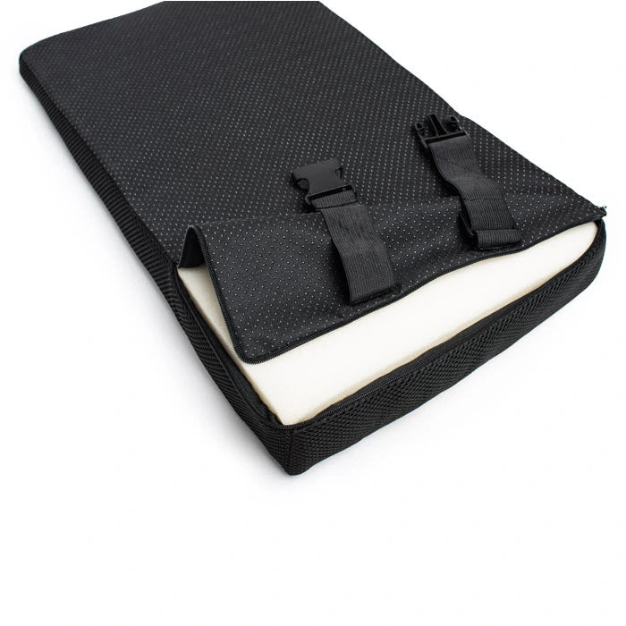 black cushion back view unzipped showing white foam with unclipped elastic strap attachment